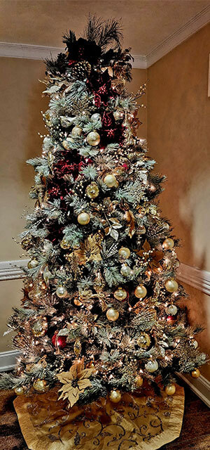 Decorated christmas tree with gold tree skirt