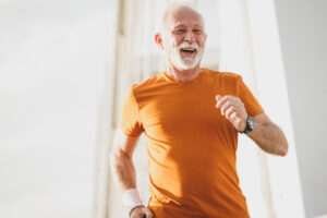 Man staying active by going on a run in senior living near Covington.